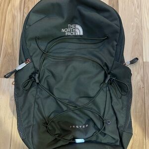 The North Face Woman’s green Backpack Jester bag with light pick accents.